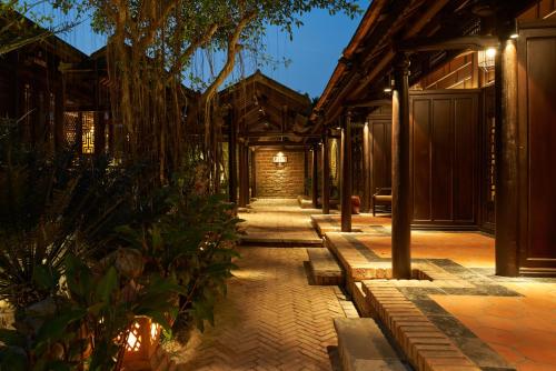a courtyard of a house with a pathway at Ancient Huế Garden Houses in Hue