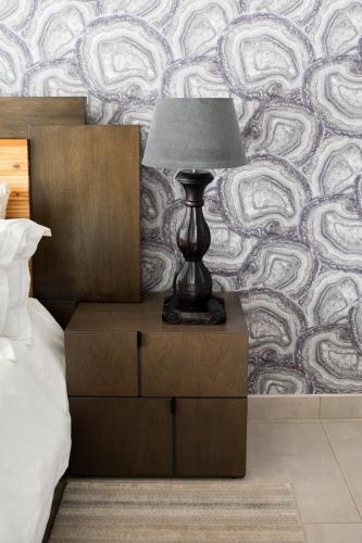 Ένα ή περισσότερα κρεβάτια σε δωμάτιο στο The African Penguin Guesthouse
