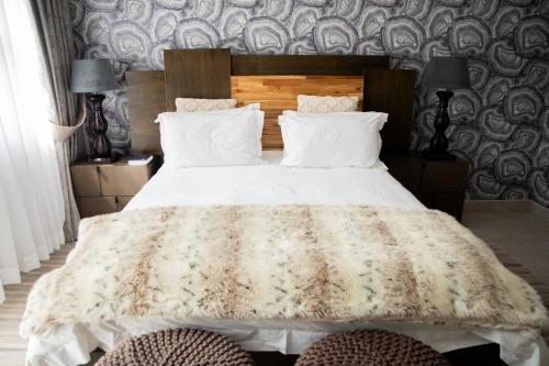 Ένα ή περισσότερα κρεβάτια σε δωμάτιο στο The African Penguin Guesthouse