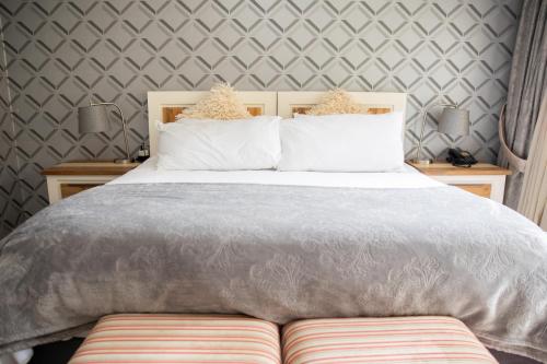 Ένα ή περισσότερα κρεβάτια σε δωμάτιο στο The African Penguin Guesthouse