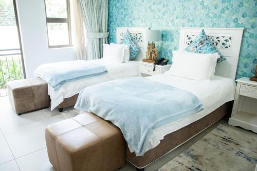 Ένα ή περισσότερα κρεβάτια σε δωμάτιο στο The African Penguin Guesthouse