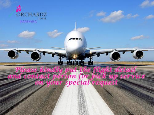 an airplane is sitting on a runway with a quote at Orchardz Hotel Bandara in Tangerang