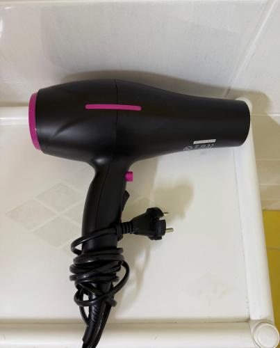 a black blow dryer sitting on top of a counter at Villa Lucija in Ohrid
