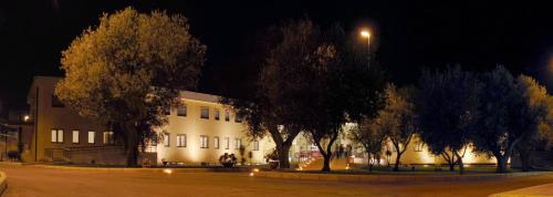 a building at night with trees in front of it at Casa di Ospitalità religiosa San Francesco d'Assisi - BA in Bari