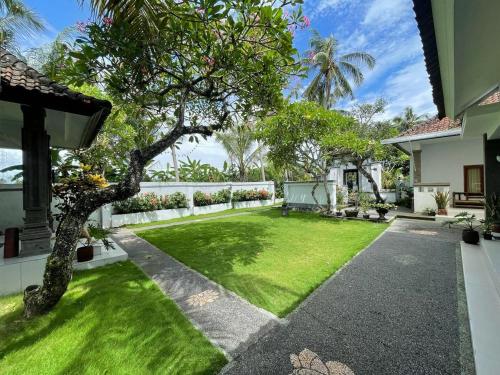 an image of a garden in a house at Ananda Villa Yeh Gangga by The Lavana - 4 Bedroom Villa with Private Pool in Krambitan