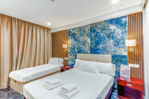 Katil atau katil-katil dalam bilik di Costa Marbella Star Light