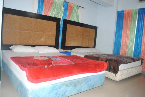 Llit o llits en una habitació de Hotel Sea Alif