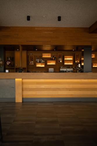 a waiting room with a bench in a building at GAZDA Hotel&Restaurant - Self Chek-In in Jesenice