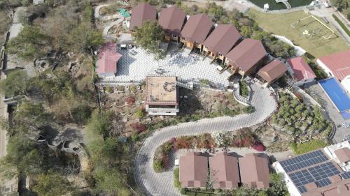 an overhead view of a park with a pool at Bamboo Saa Resort & Spa - Udaipur in Udaipur
