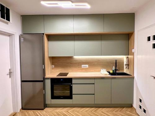 Kuchyňa alebo kuchynka v ubytovaní Harmony Suite 32