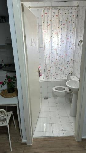 a bathroom with a toilet and a sink at BIRDS VIEW SERRES Διαμέρισμα στο Κέντρο in Serres