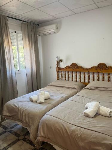 Una cama o camas en una habitación de Hostal Quinto Pino