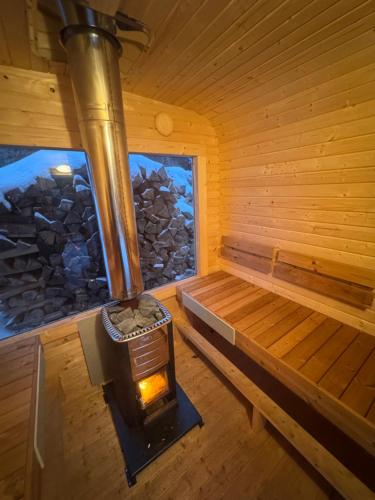 an inside view of a sauna with a wood stove at Penzion Zvonička in Trutnov