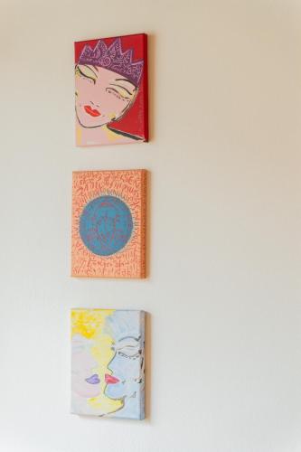 four pictures hanging on a wall at Pension Lahn in Rablà