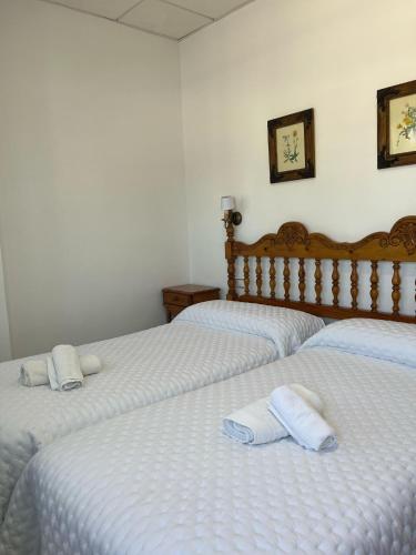 Una cama o camas en una habitación de Hostal Quinto Pino