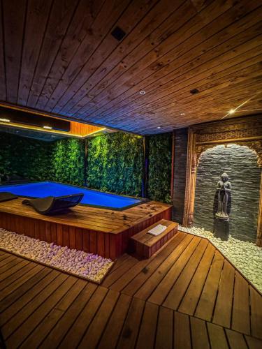 a large wooden room with a large tub in it at Clos des Thermes-Secret Garden in Liège