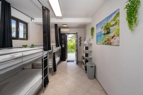 a bathroom with a large sink and a mirror at Luxury Seaview Apartment in Juraši