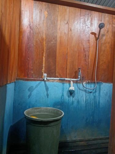 a bathroom with a bucket and a shower at Sehati Homestay - Raja Ampat in Besir
