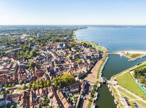 an aerial view of a town next to the water at Tiny Lodge Basic in Harderwijk