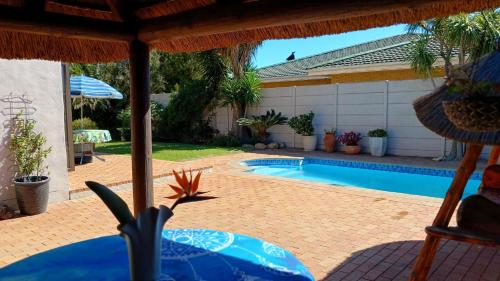 Kolam renang di atau dekat dengan A new apartment with a view at Goedehoop, Strand, Western Cape