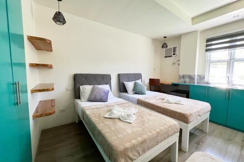 Ένα ή περισσότερα κρεβάτια σε δωμάτιο στο Accessline Inn Boracay powered by Cocotel