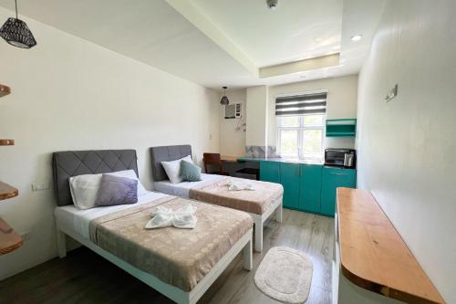Ένα ή περισσότερα κρεβάτια σε δωμάτιο στο Accessline Inn Boracay powered by Cocotel