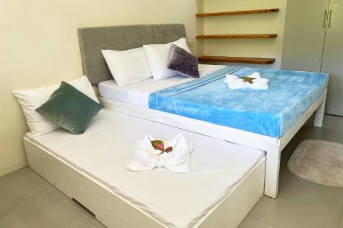 Ένα ή περισσότερα κρεβάτια σε δωμάτιο στο Accessline Inn Boracay powered by Cocotel
