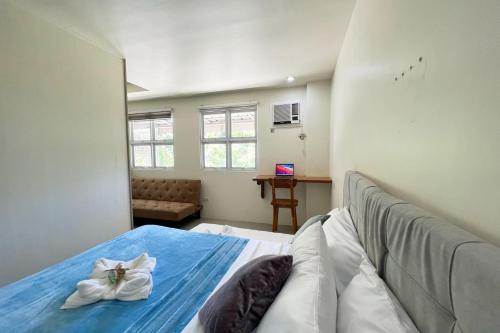 Ένα ή περισσότερα κρεβάτια σε δωμάτιο στο Accessline Inn Boracay powered by Cocotel