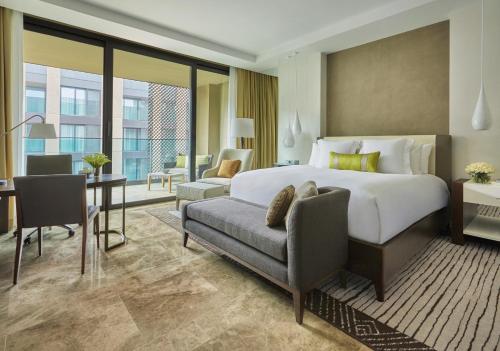 a hotel room with a bed and a desk at Four Seasons Hotel Casablanca in Casablanca