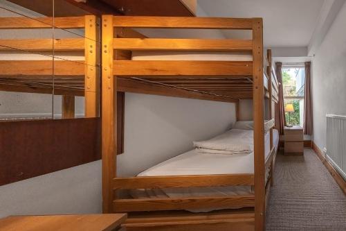 a couple of bunk beds in a room at Aberdyfi Sea View Apartment in Aberdyfi