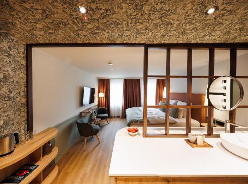 Postel nebo postele na pokoji v ubytování Boutiquehotel Ochsen