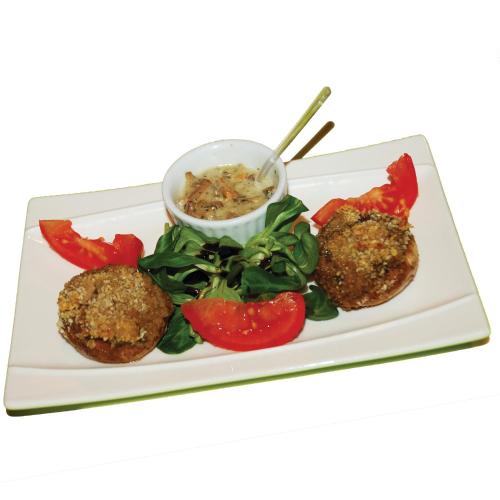 a plate of food with two meatballs and vegetables at L'Horizon des Landes in Doazit