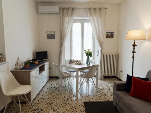a living room with a table and chairs at Appartamento Nautes in San Benedetto del Tronto