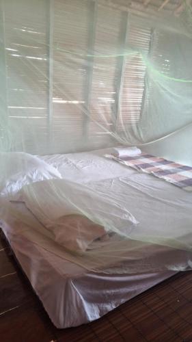 Кровать или кровати в номере Angganeti Homestay