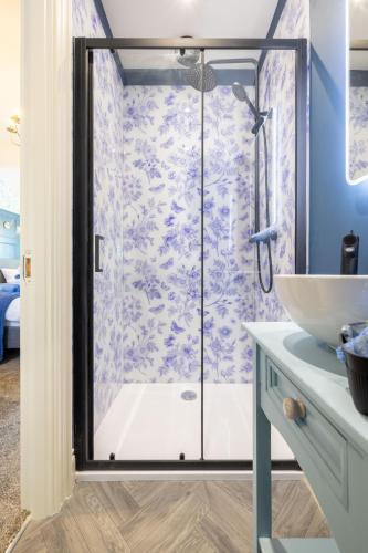 a bathroom with a shower and a sink at Boutique Stays at 56 in Newtownards
