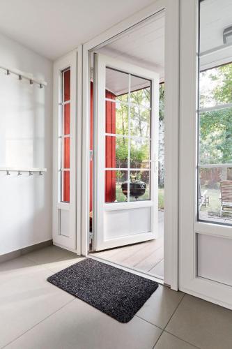 an empty room with a door and a rug at Gut Pälitzhof in Wustrow