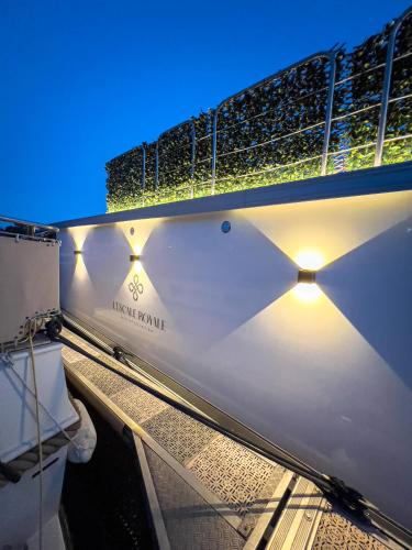 a boat with lights on the side of it at L'Escale Royale Saverne - Rhin - Strasbourg in Saverne