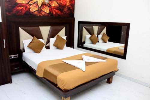 Katil atau katil-katil dalam bilik di Hotel Aayan Lodging & Boarding