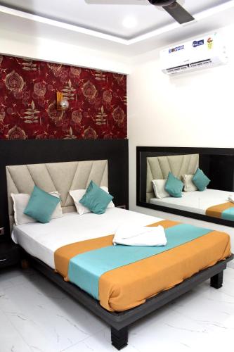 Katil atau katil-katil dalam bilik di Hotel Aayan Lodging & Boarding