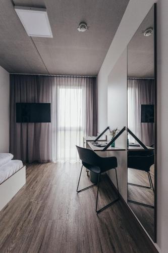 Postel nebo postele na pokoji v ubytování Motel Schlafraum Weng-Dein smartes Hotel-contactless check-In