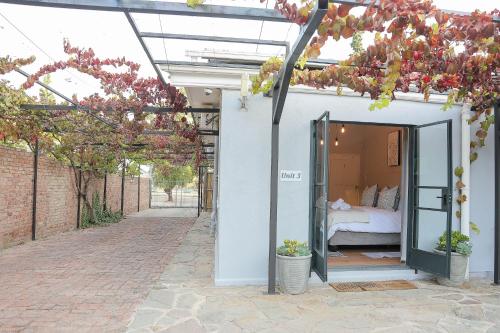 Ένα ή περισσότερα κρεβάτια σε δωμάτιο στο The Courtyard Room