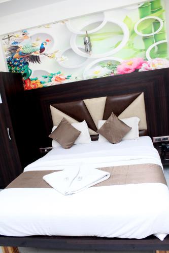 Katil atau katil-katil dalam bilik di Hotel Aayan Lodging & Boarding