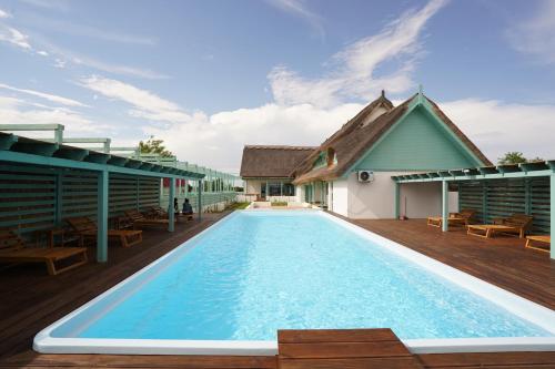a swimming pool on the deck of a house at Doi Căpitani II in Crisan