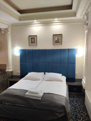 Postel nebo postele na pokoji v ubytování Hotel Venecia Palace