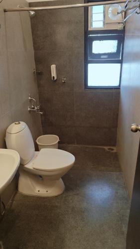 Vannas istaba naktsmītnē Angson Apartment