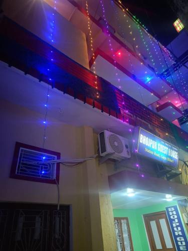 a sign in a room with a speaker and lights at Bhojpur Guest House in Gaya