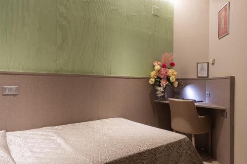 Hotel Baffo Rossoにあるベッド