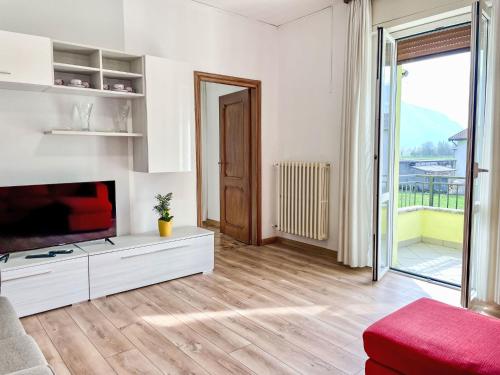 a living room with a flat screen tv on a dresser at Apartment Pippo by Interhome in Masina