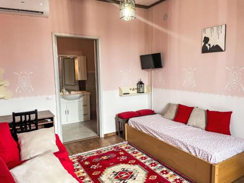 a bedroom with a bed and a couch in it at Holiday Home Il Cavaliere by Interhome in Castellero
