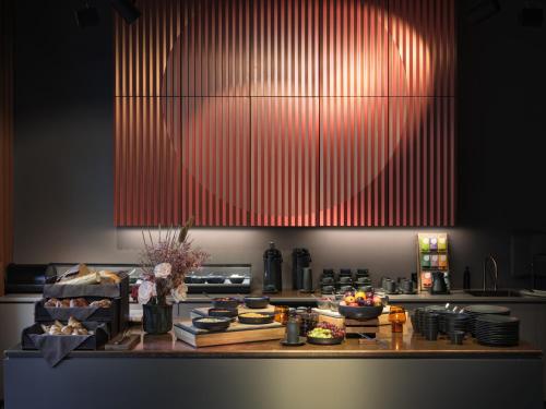 a kitchen with a counter with food on it at lyf East Frankfurt in Frankfurt